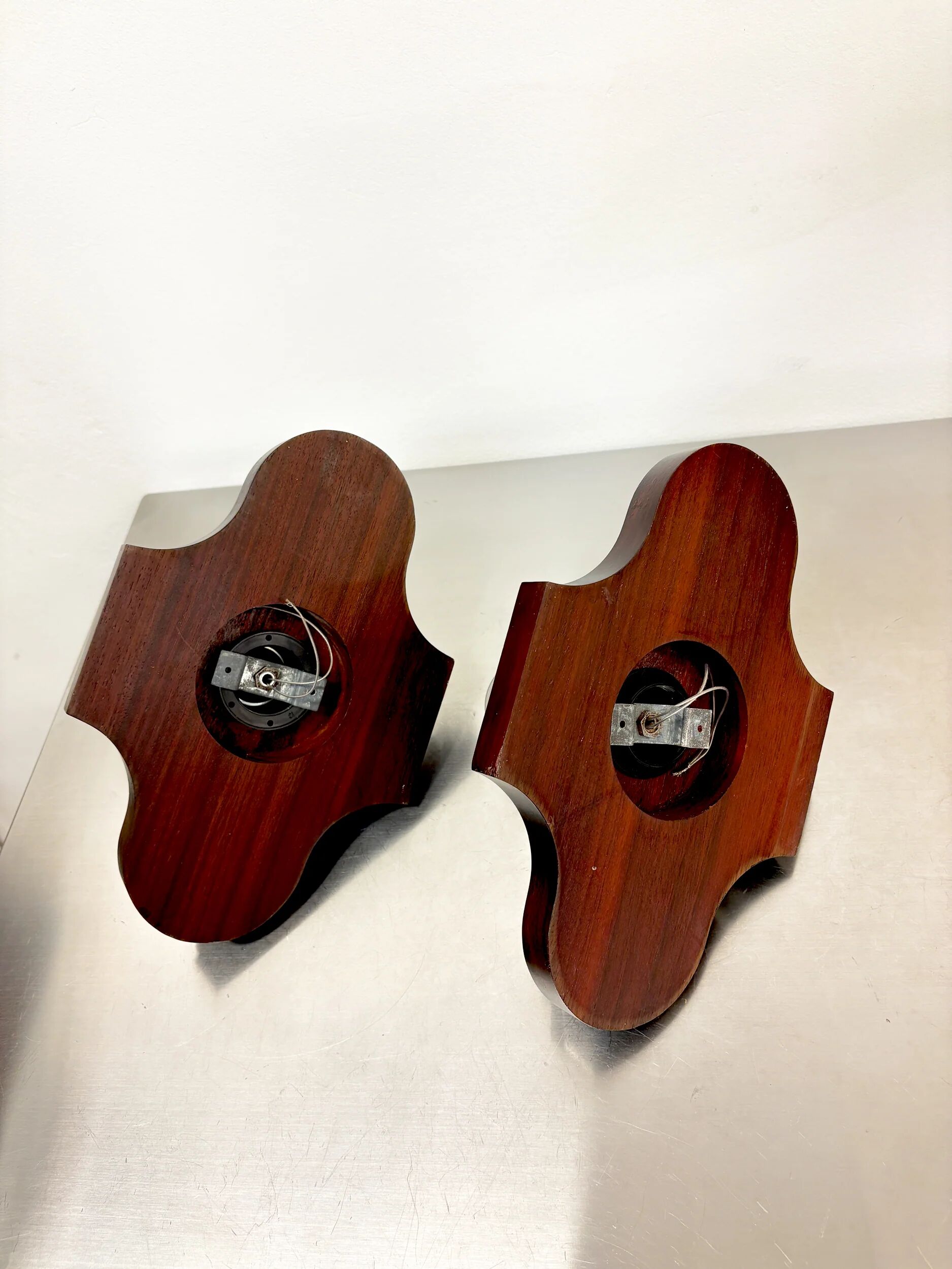 Pair of geometric Art Deco wall lights, carved wood, France, 1960s