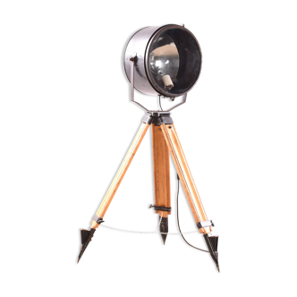 Industrial spotlight on wooden tripod floor lamp