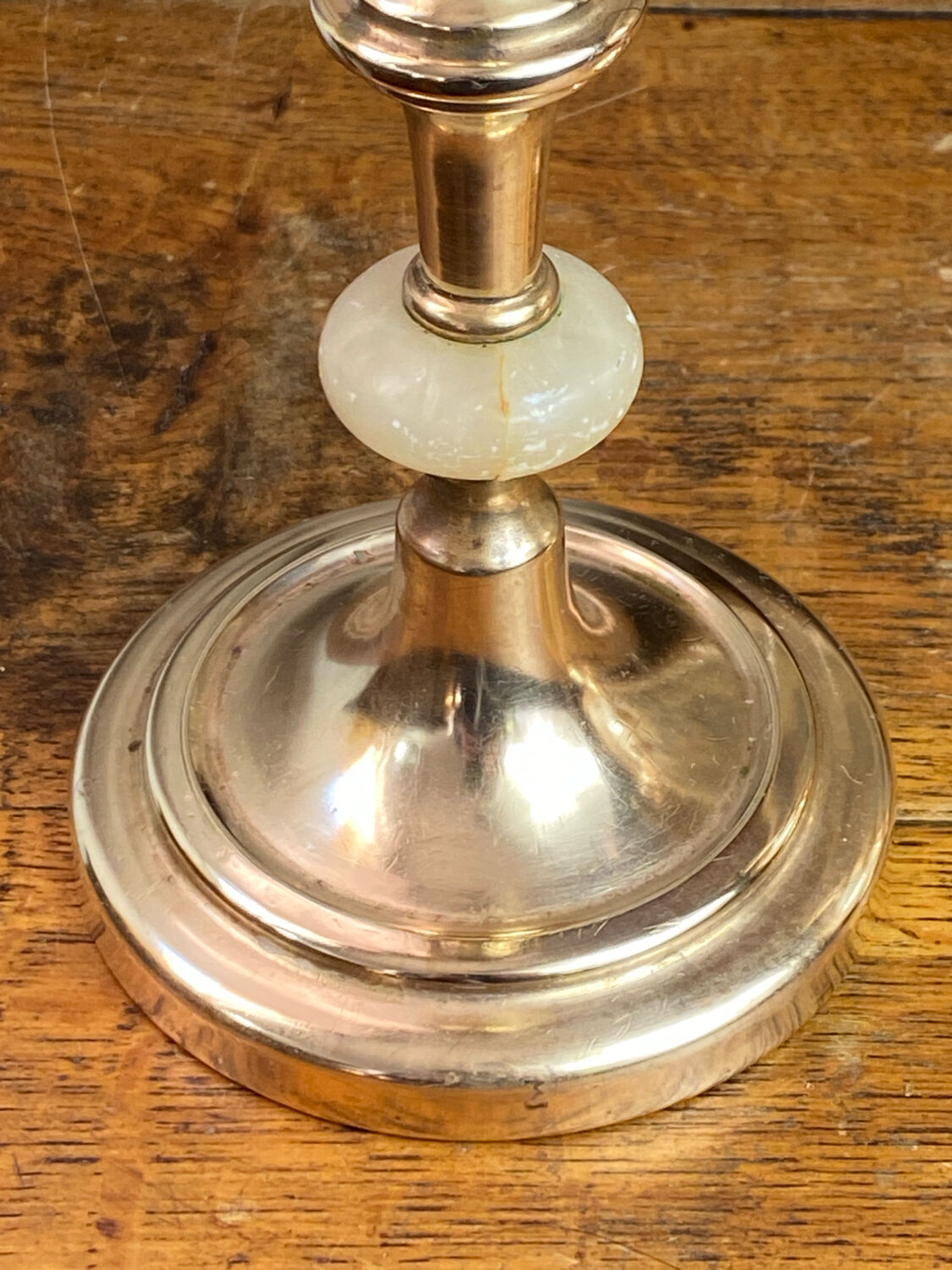Pair of brass and stone candlesticks
