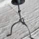Antique tripod metal candlestick with knot decoration