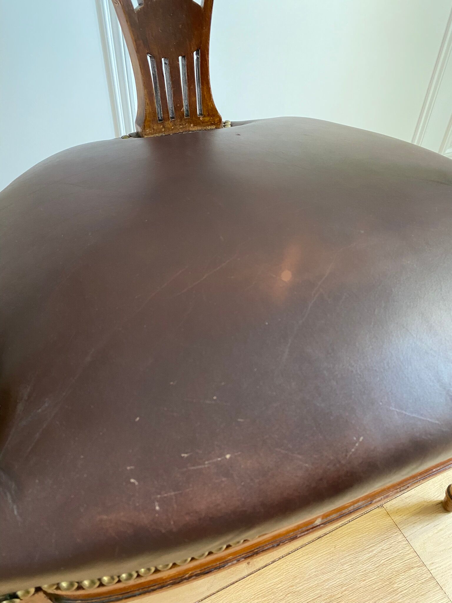 Vintage office chair in wood and brown studded leather late nineteenth