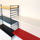 Tomado wall unit with metal shelves by A. Dekker