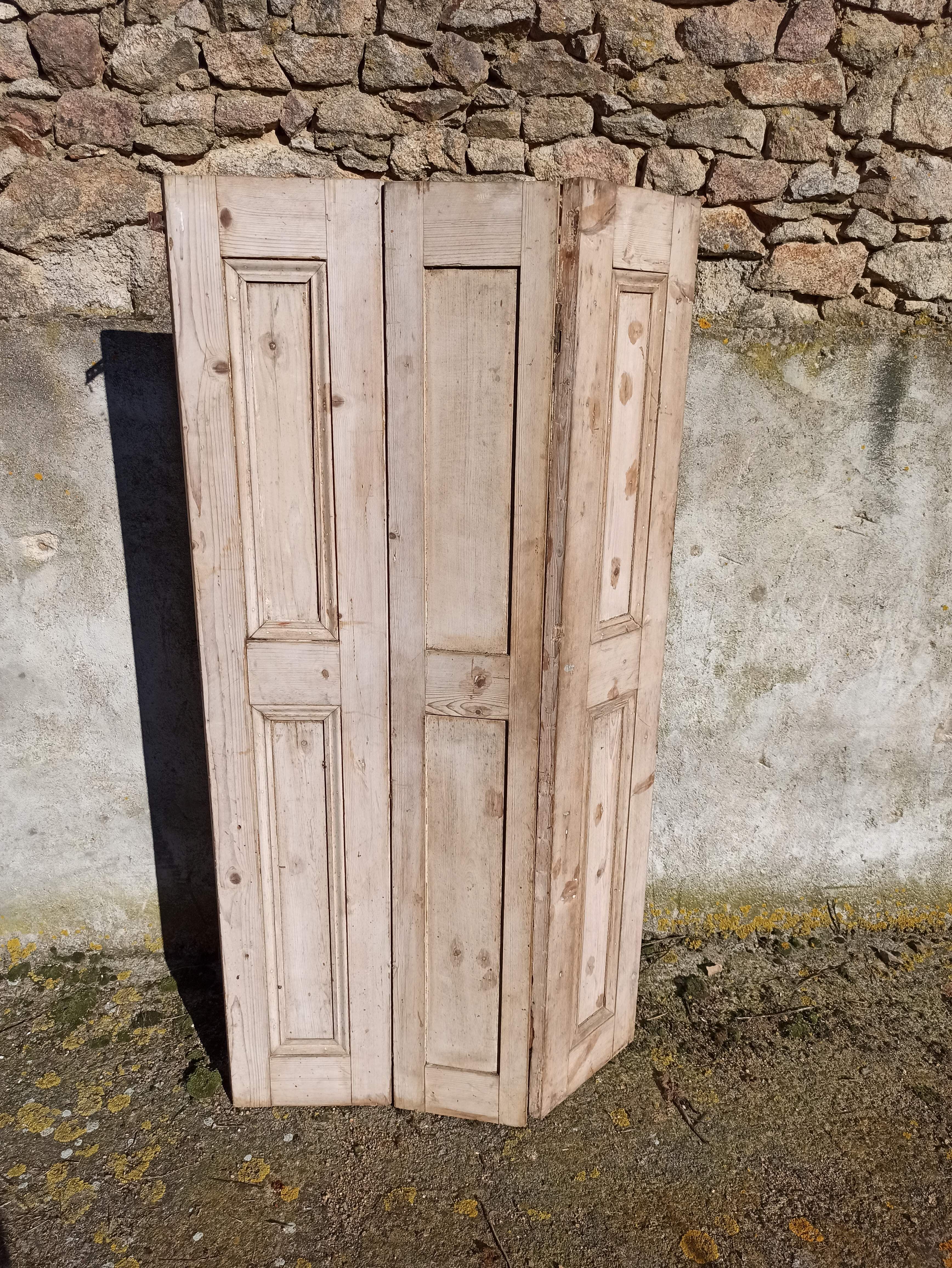 Old trio of wooden screen doors