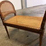 Wooden and cane bench (piano bench)