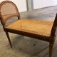 Wooden and cane bench (piano bench)