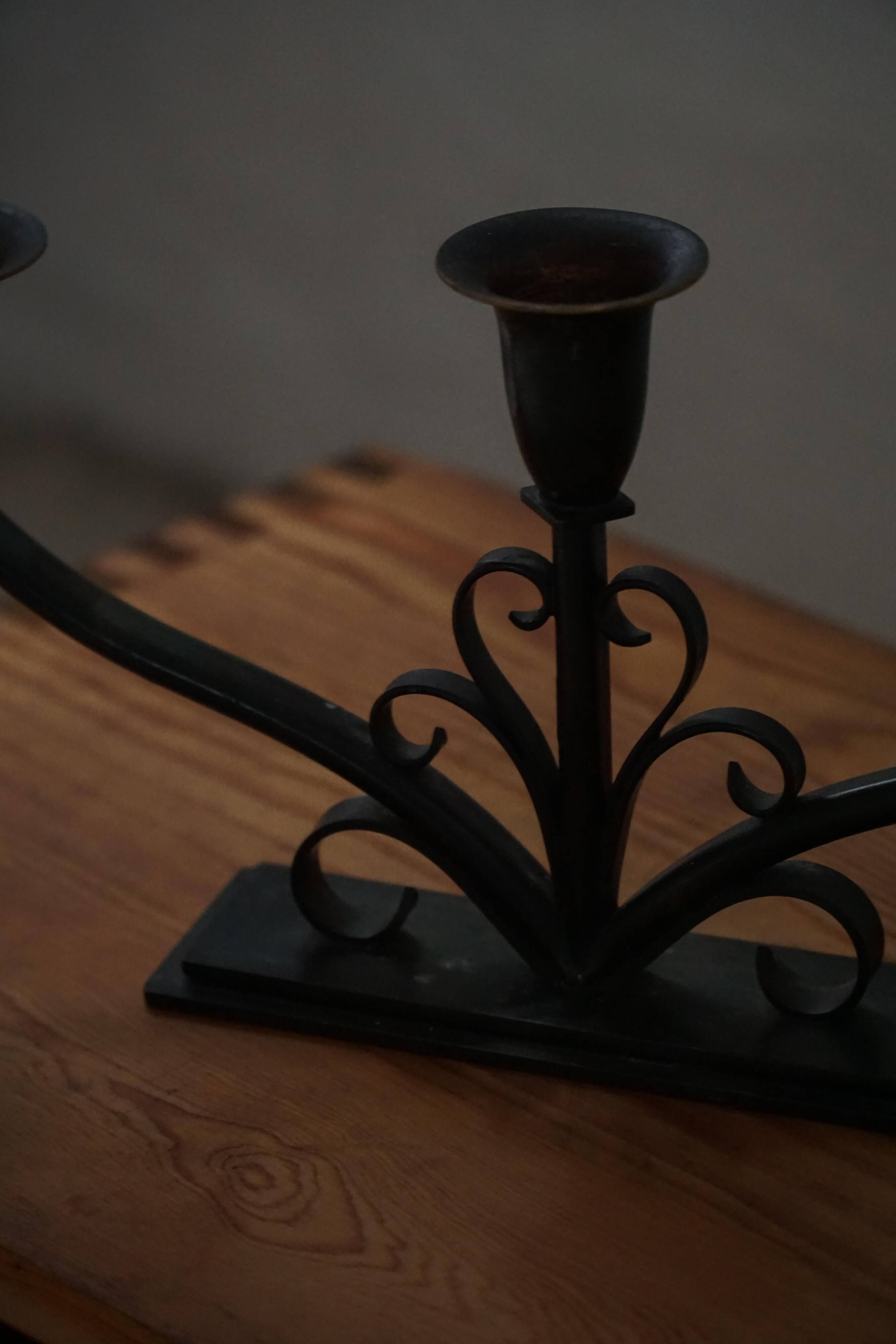 Early 20th century, pair of Danish Art Deco candlesticks in metal with three arms, 1930s.