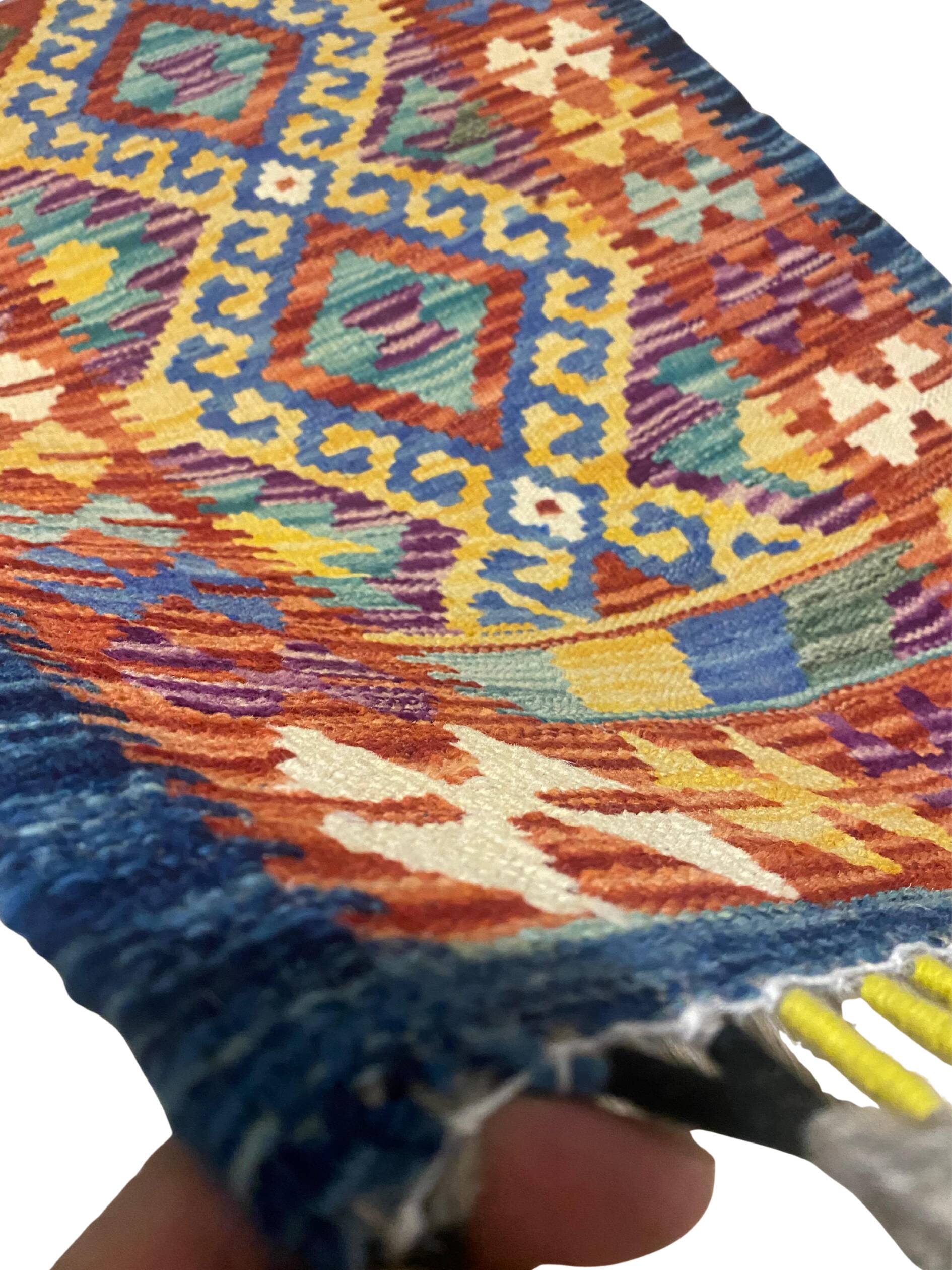 Afghan kilim rug in multicolored wool, geometric patterns