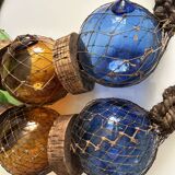 Fishing floats made of blown glass, cork, and rope. France, 1960s.