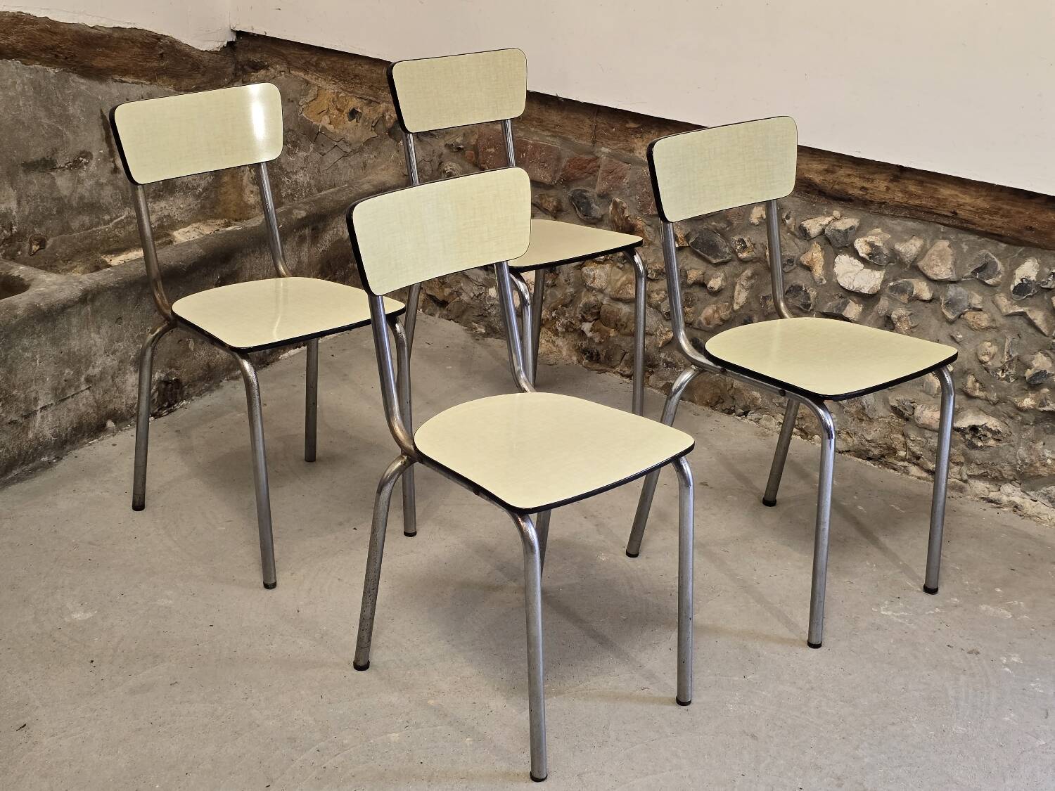 Set of 4 light yellow formica chairs