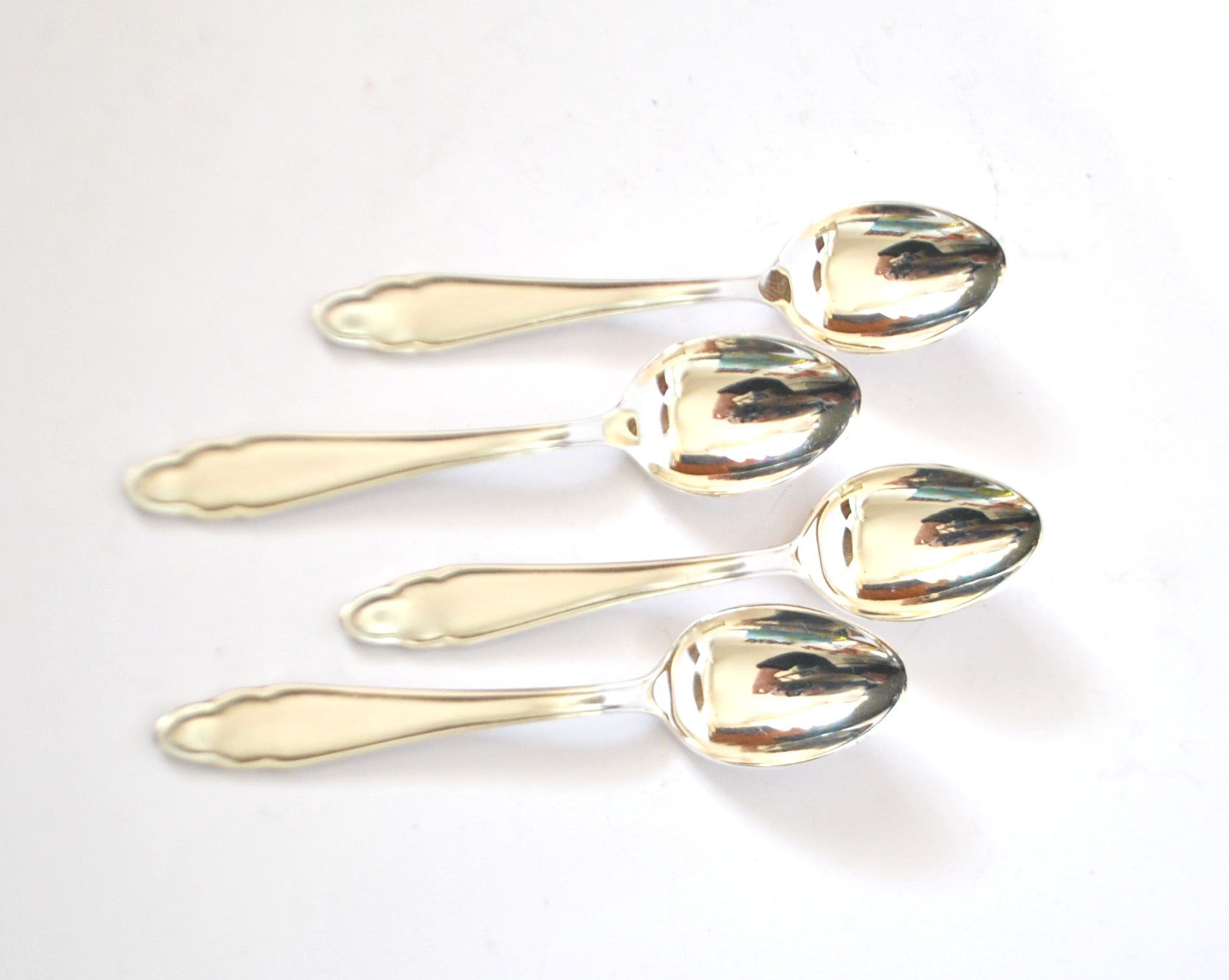 DEETJEN set of 4 silver-plated dessert spoons with a modernist scalloped design.