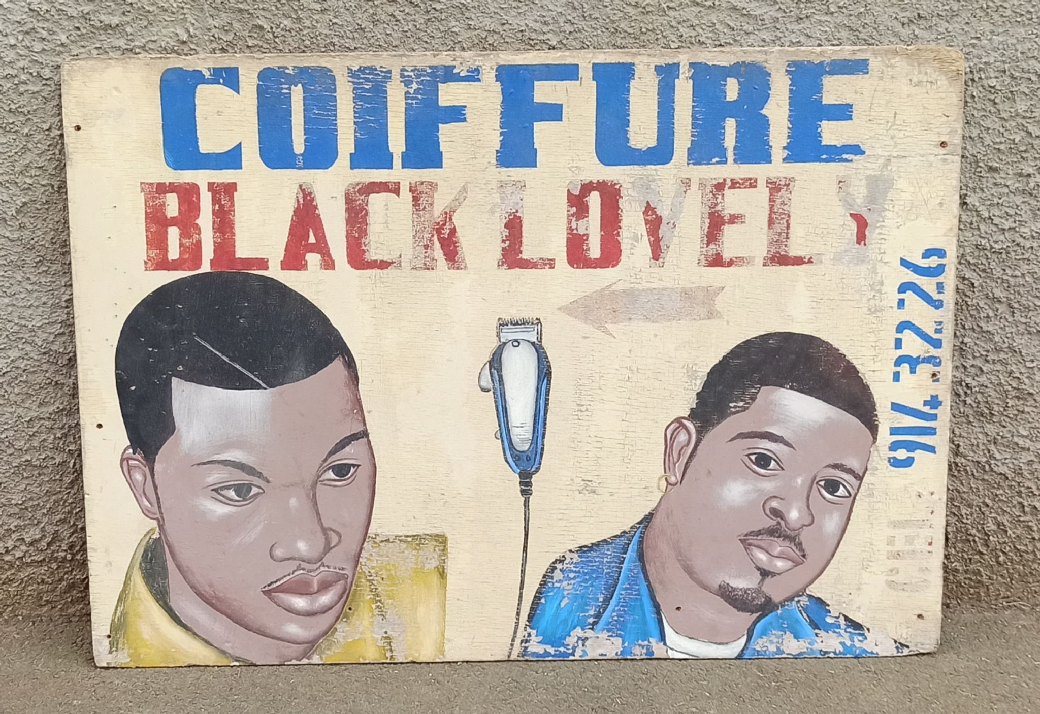Ancienne enseigne de coiffeur africain