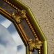 Vertical mirror, gold frame with beading.