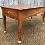 Antique solid cherry farmhouse table with 2 end drawers and 1 pull-out.