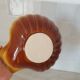 Brown and white ceramic shell bowl