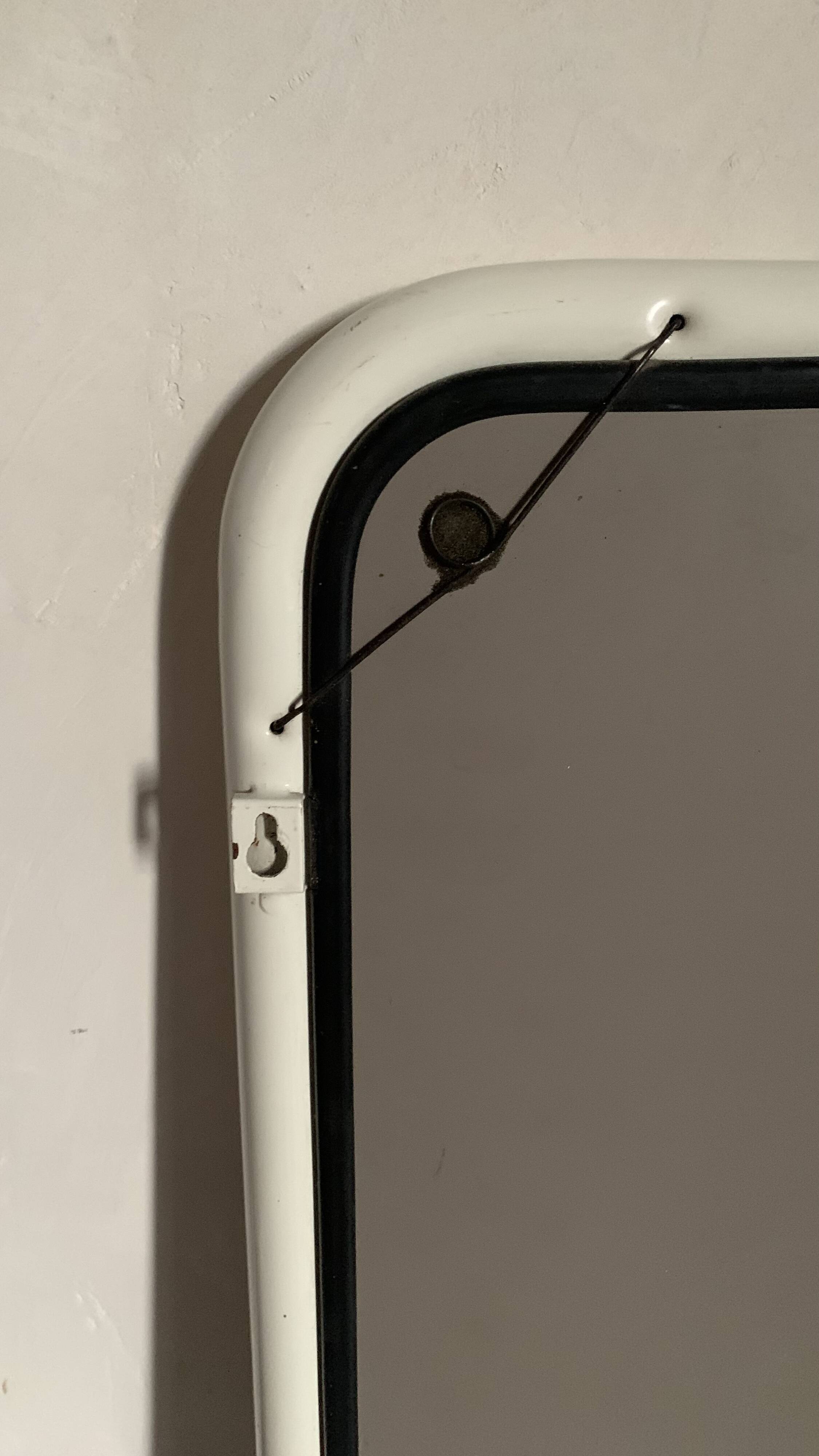 White tubular metal wall mirror