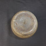 Ancient vase in khaki grey-green cracked sandstone