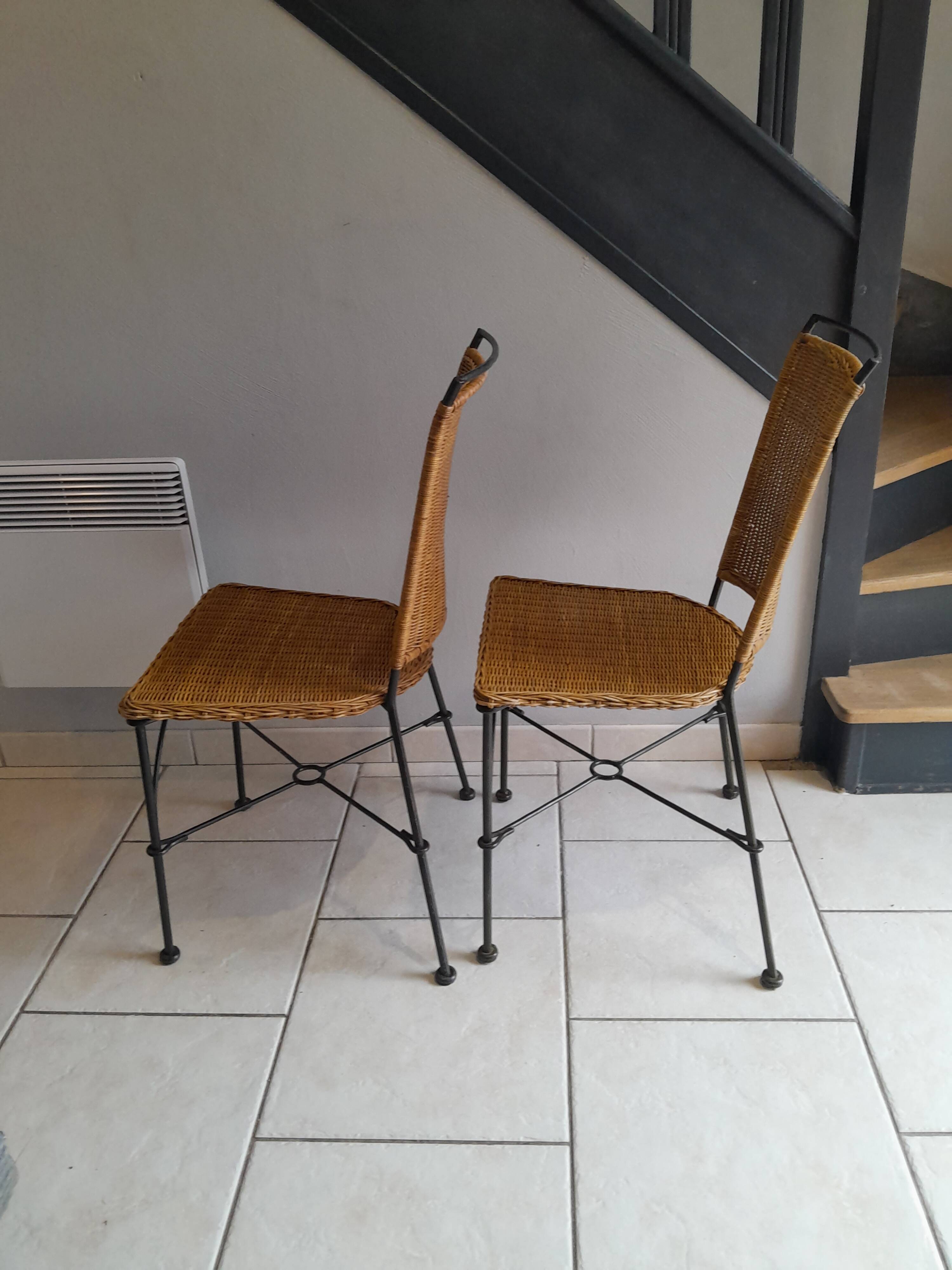 Pair of vintage wrought iron and rattan chairs