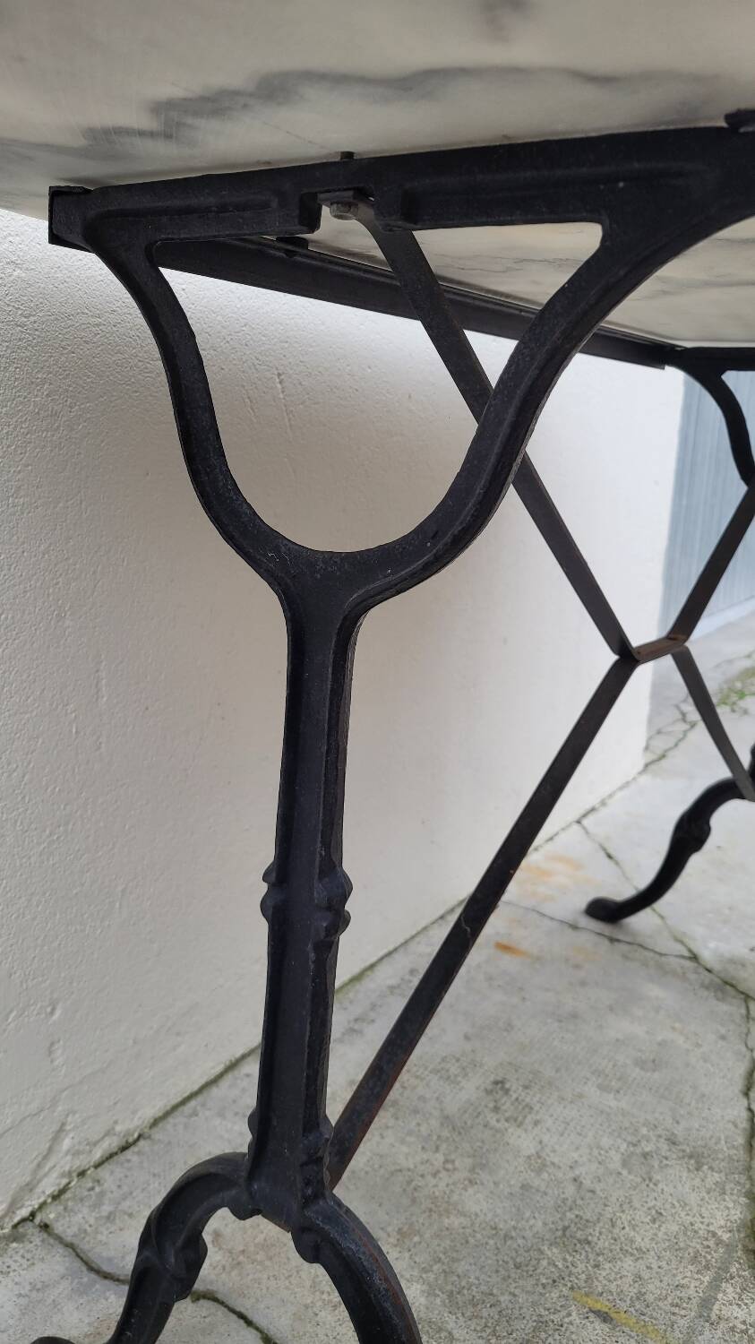 Antique cast iron bistro table with oval marble top