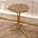 Golden pedestal table in smoked glass