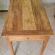 Old farmhouse table made of solid walnut wood.
