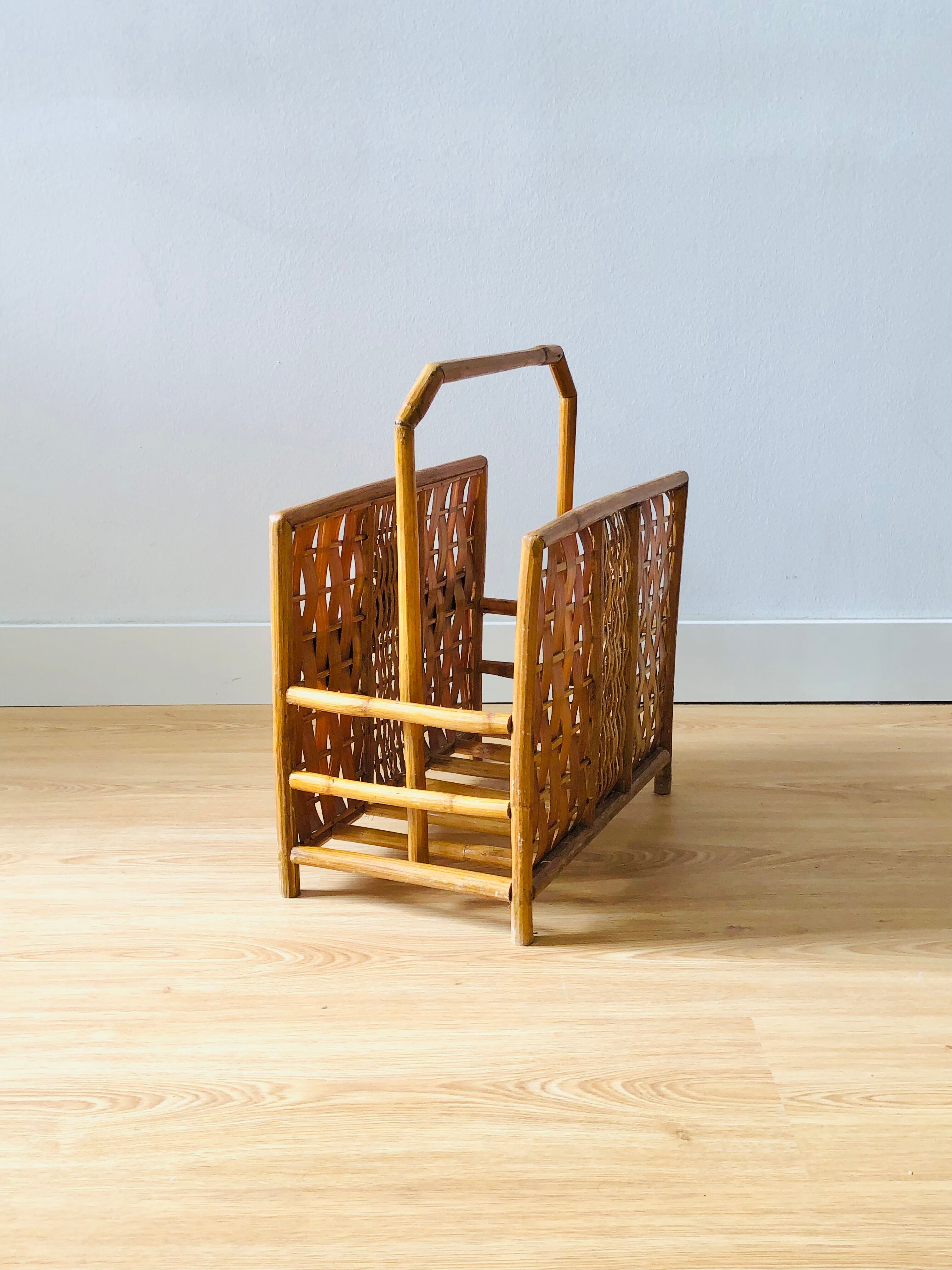 Vintage rattan magazine holder with floral decoration