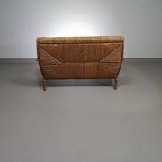 Vintage French papercord sofa with a metal frame base