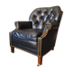 Chesterfield style leather armchair & footstool by Hancock & Moore