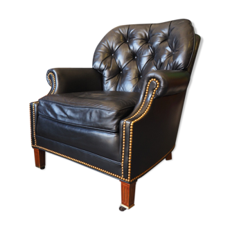 Chesterfield style leather armchair & footstool by Hancock & Moore