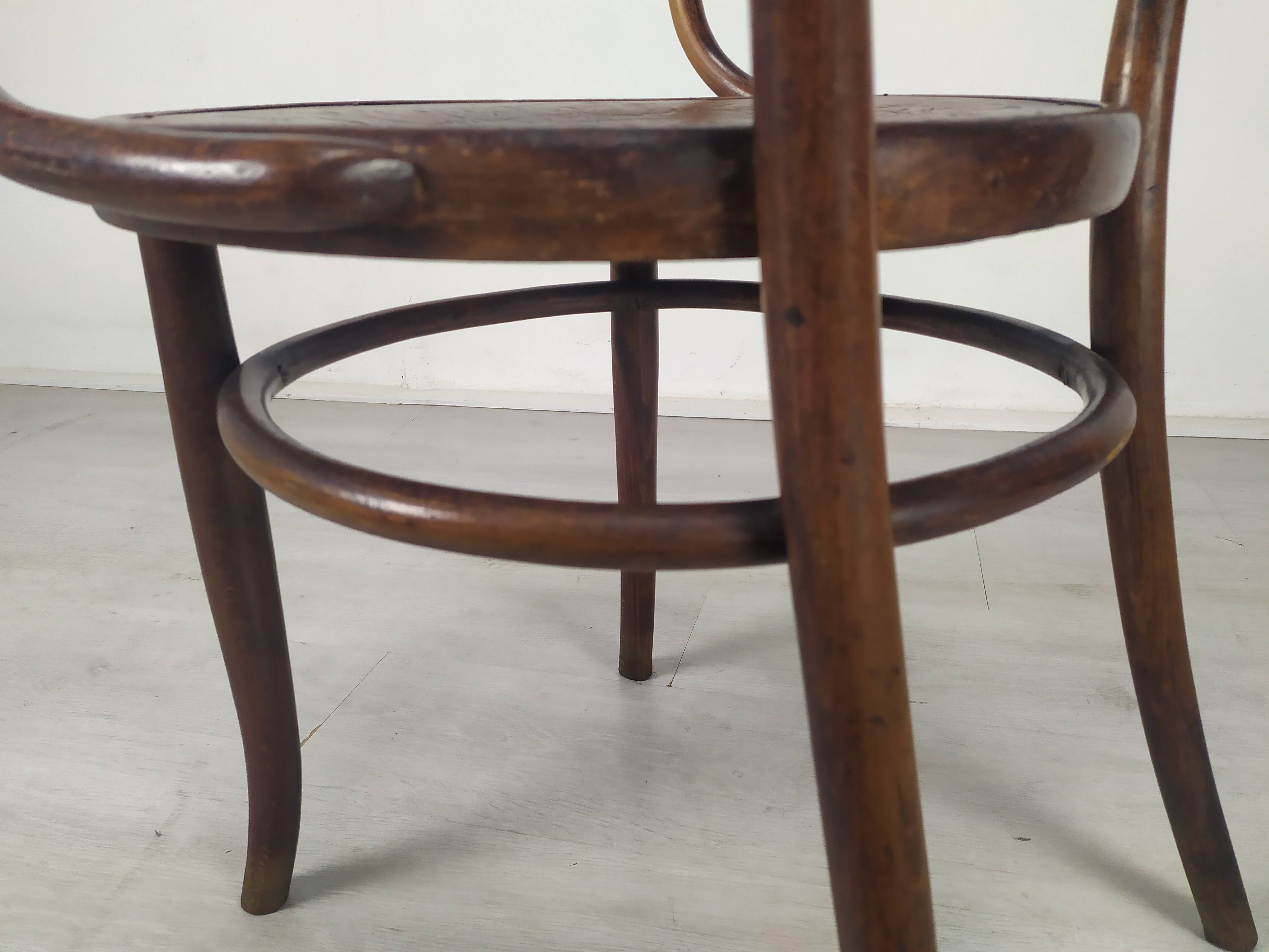 Kohn curved wooden armchair