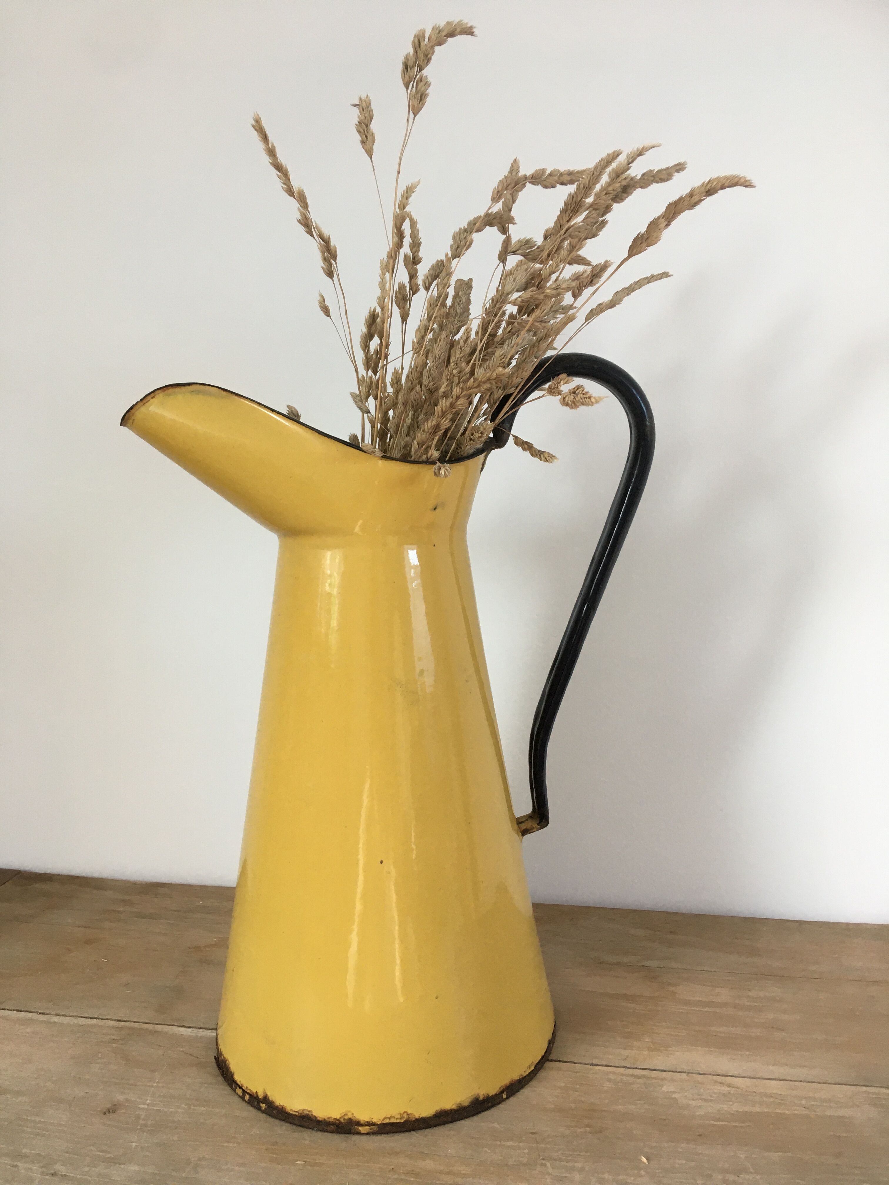 Mustard yellow enamelled sheet metal pitcher