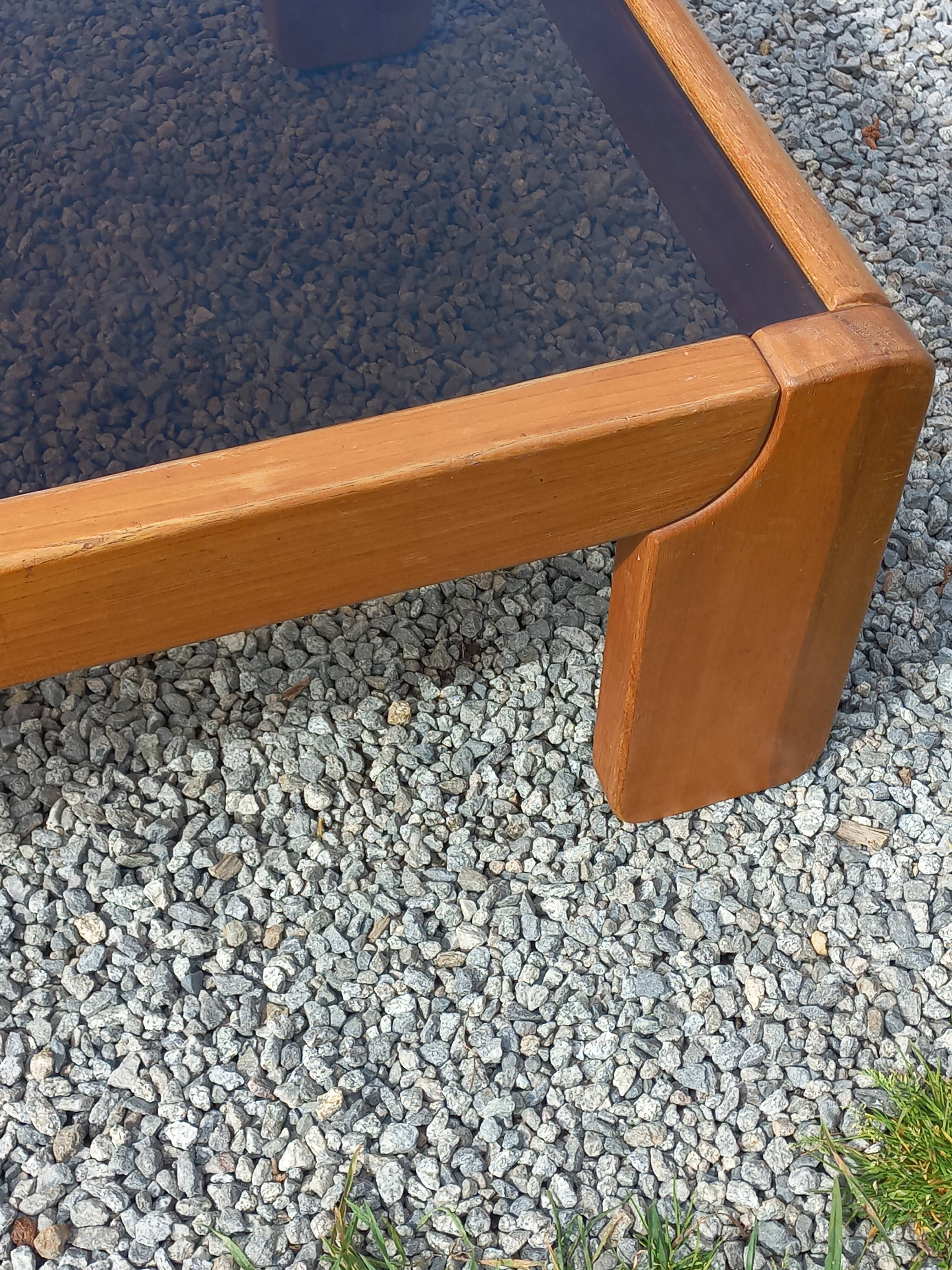 Coffee table from Regain in solid elm with a smoked glass top.