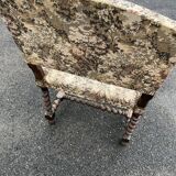 Louis XIII style armchair with twisted backrest and legs.