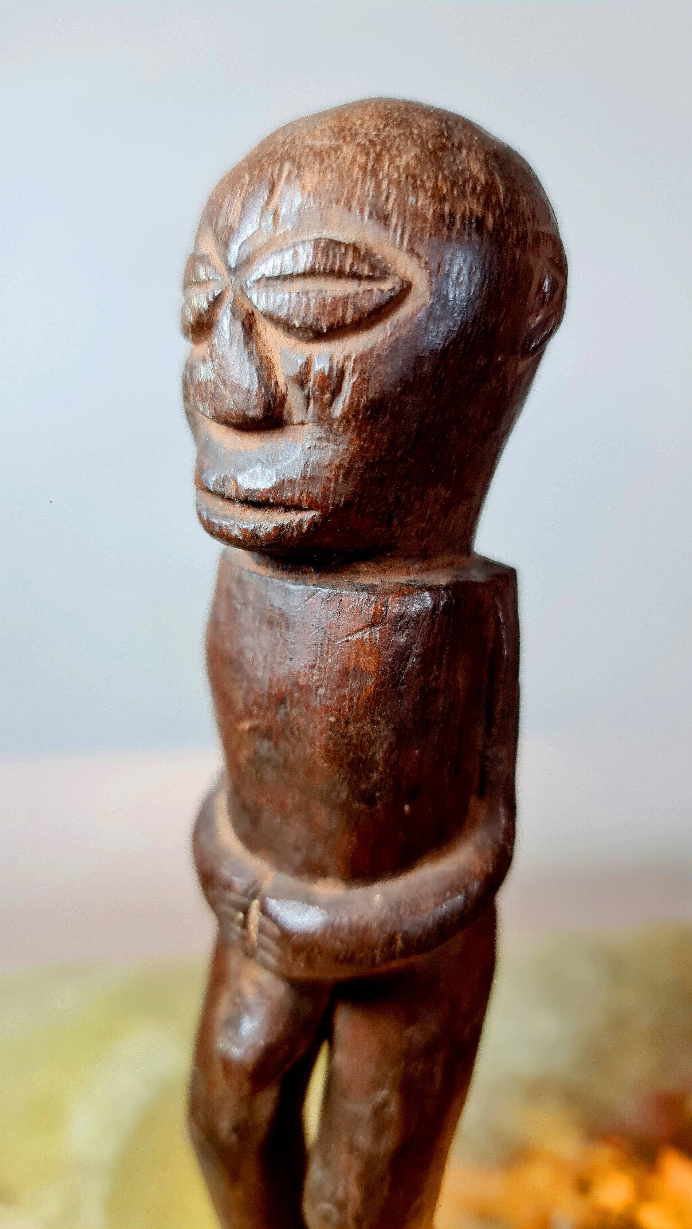 Old Fon statuette on a base, Benin
