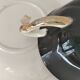 Large black, yellow iridescent and white Art Deco Saint-Amand cup.