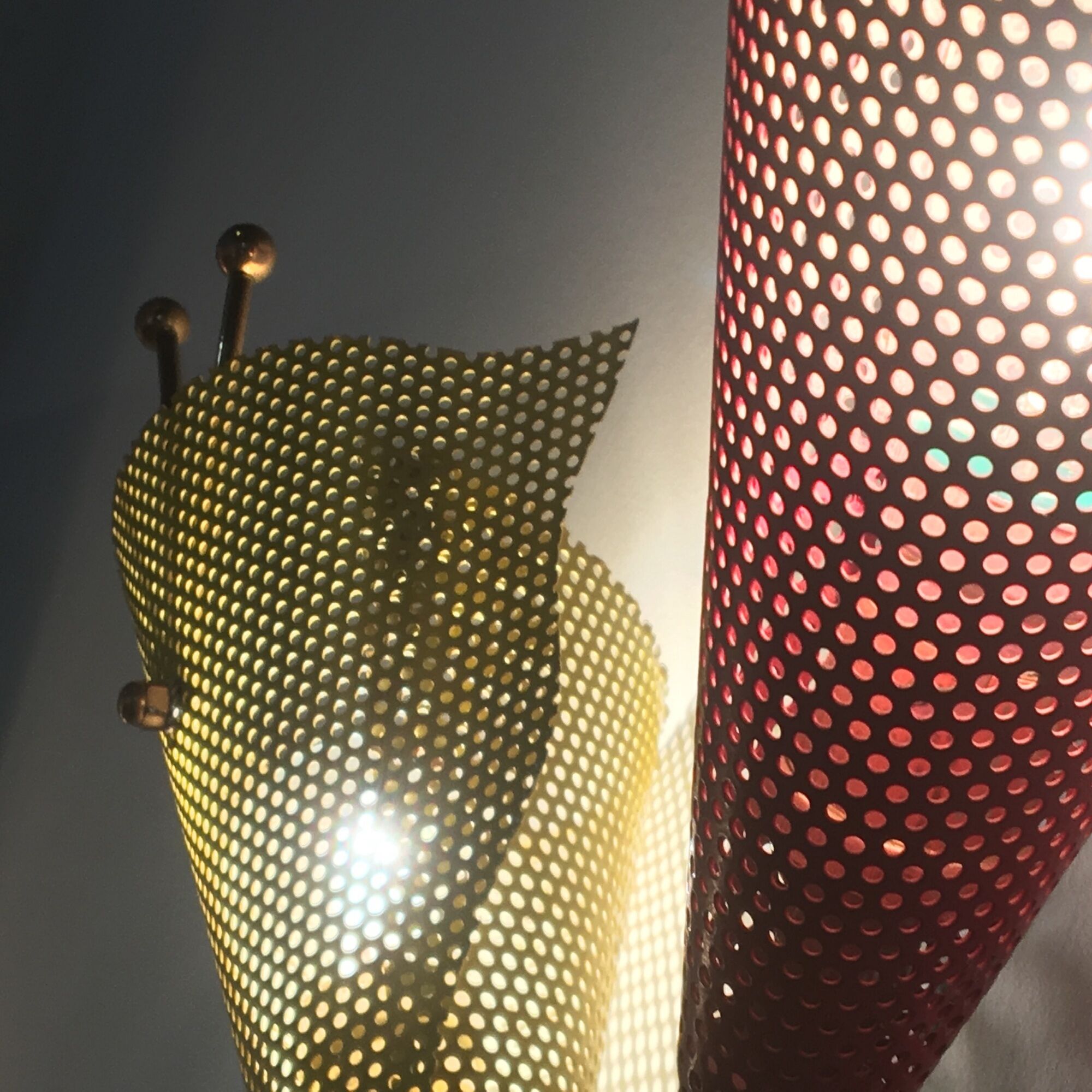 Pair of wall lamps metal perforated color, France 1950