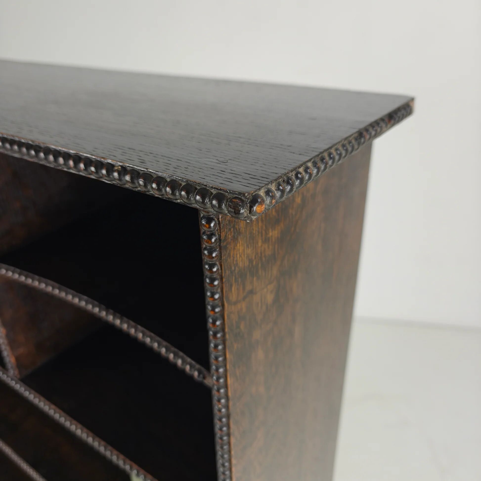 20th century open bookcase with bead motif