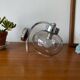 Wall light in chromed metal and smoked grey glass globe