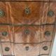 Transitional style chest of drawers in rosewood and amaranth veneer, 20th century.