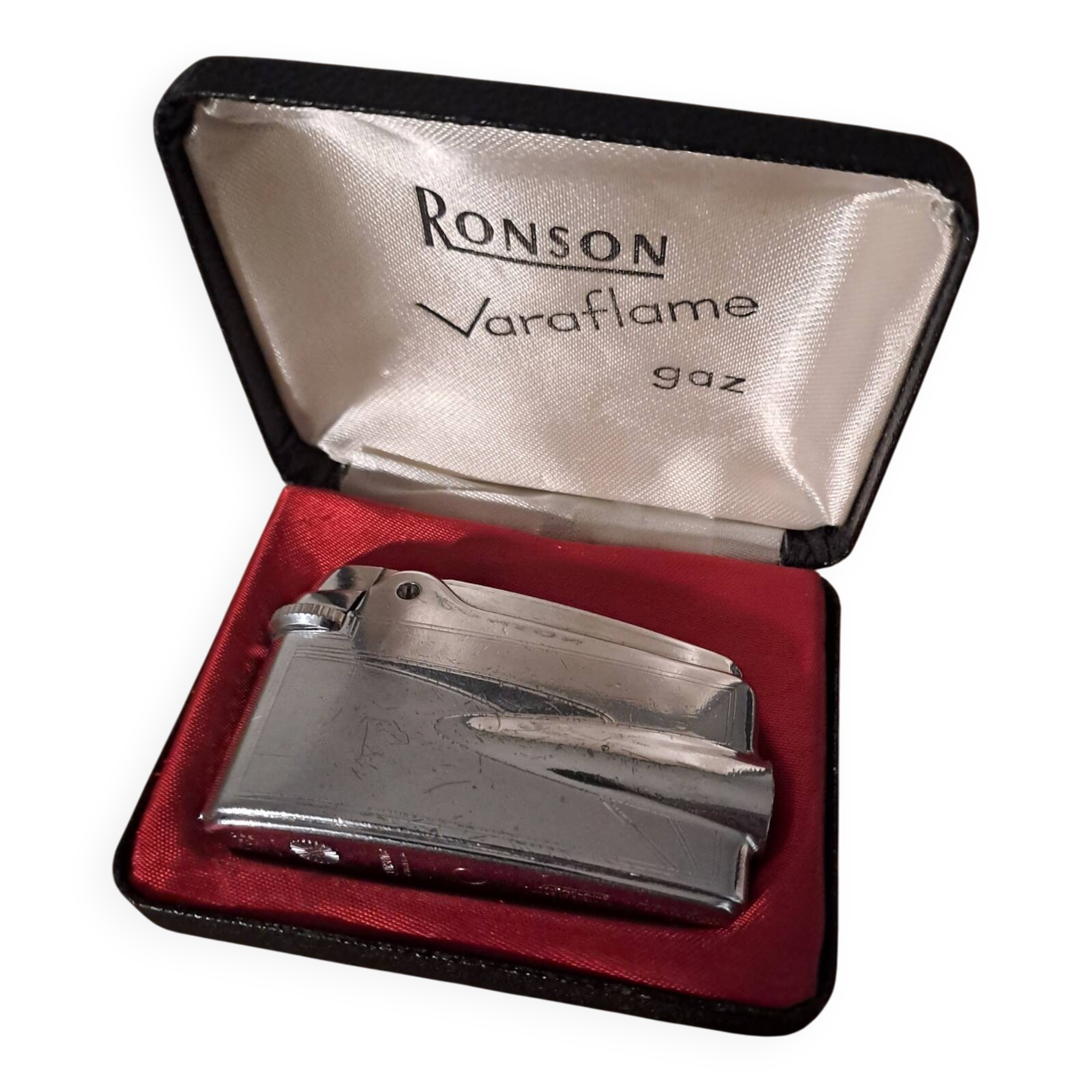 Vintage Ronson Varaflame chrome lighter and its original case.