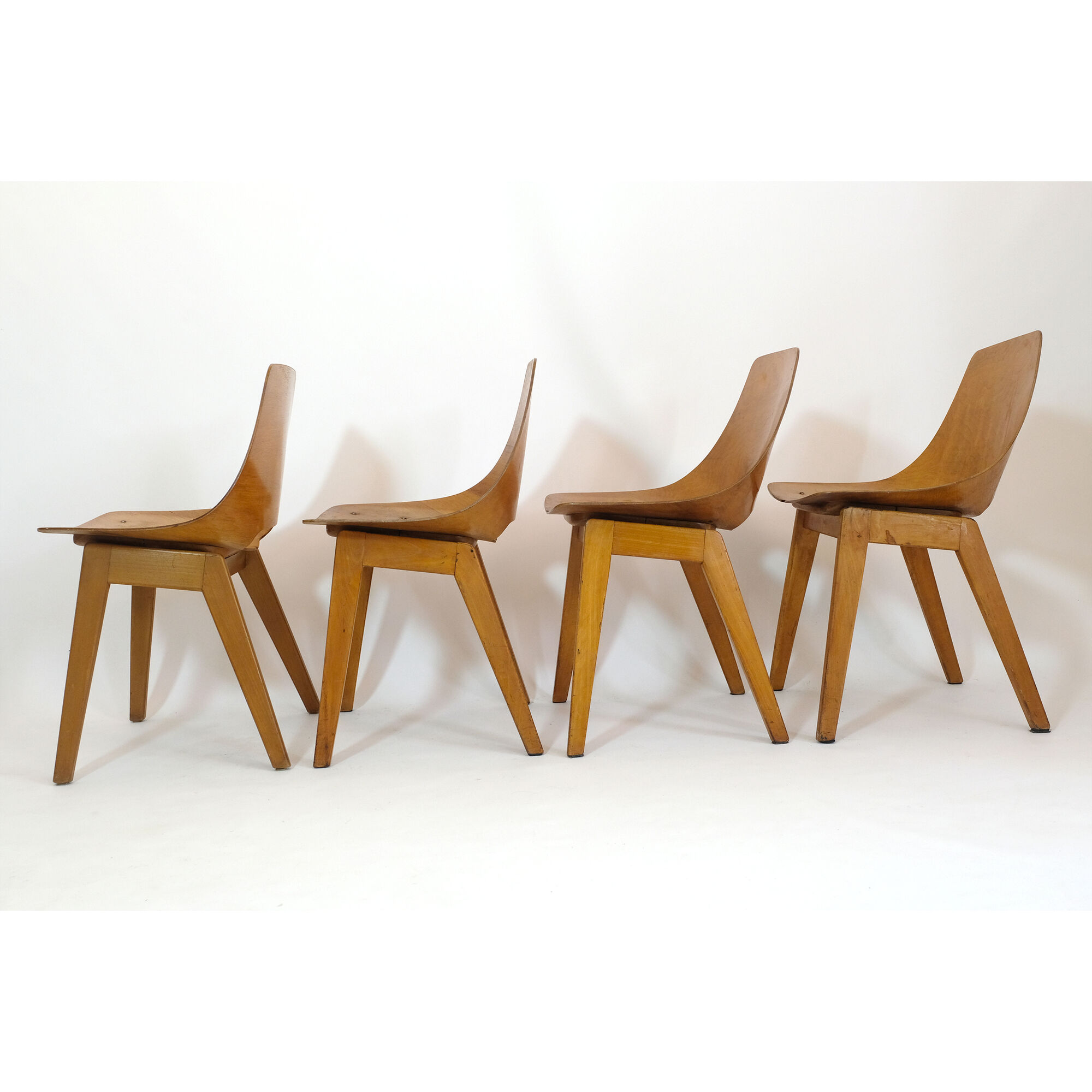 Set of 4 barrel chairs, wooden base, Pierre Guariche, Steiner, 1950s.