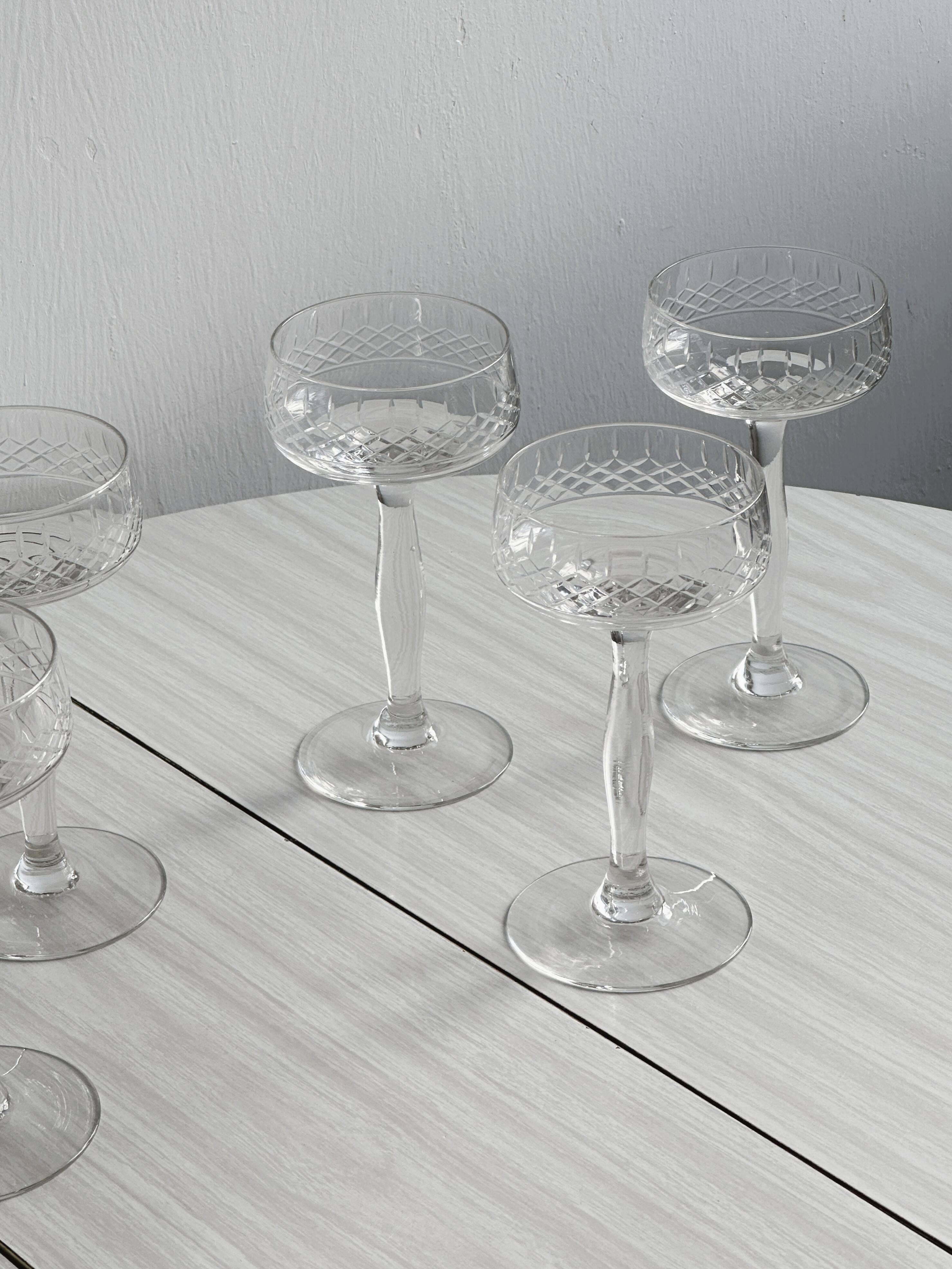 5 chiseled glass cocktail glasses.