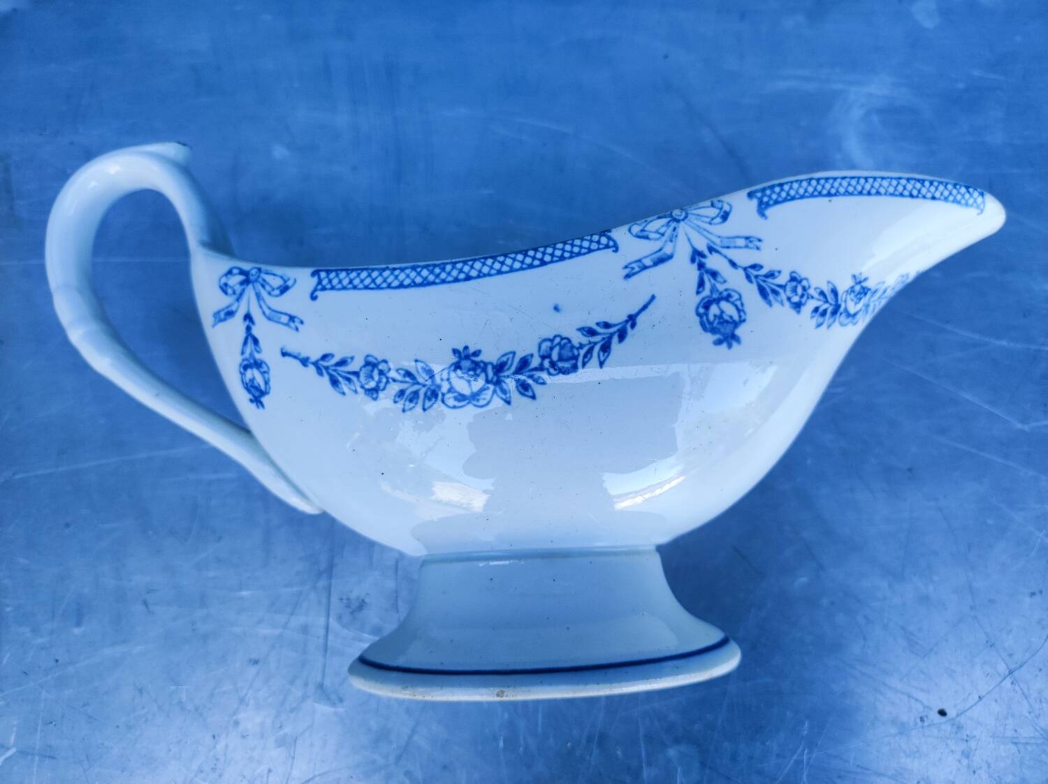 Old earthenware sauce boat