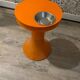Orange tam-tam by Stamp with integrated pocket.