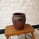 Old red and black terracotta grease pot