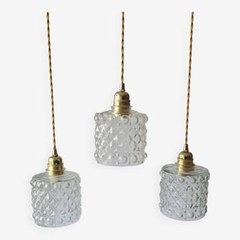Trio of molded glass pendant lights