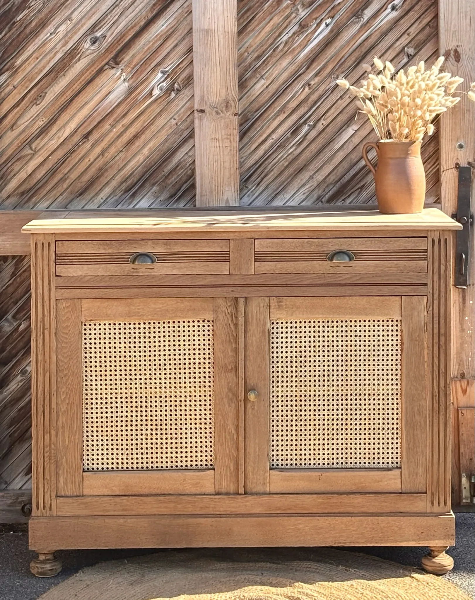 Old buffet in raw solid oak and cane.