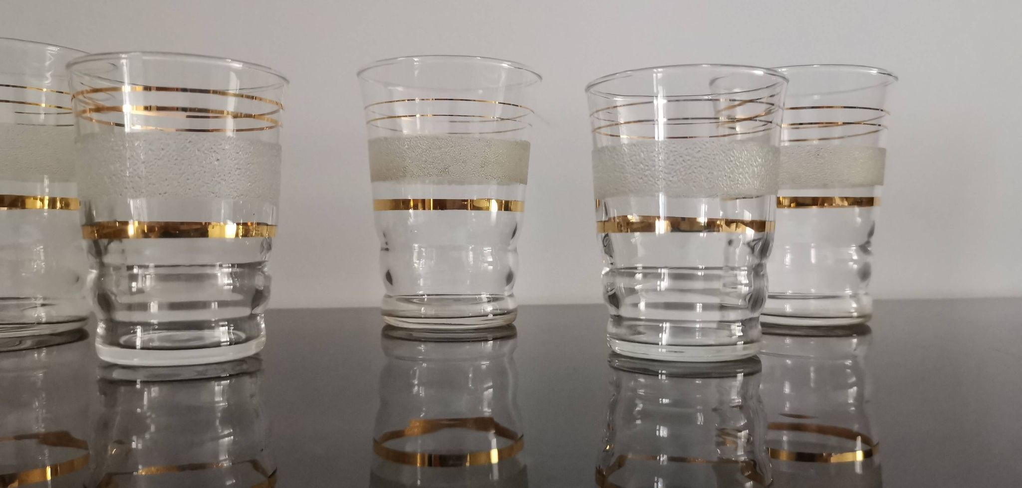 Set of 5 water glasses and 5 aperitif glasses with granite decorations and gold edging from the 1950s