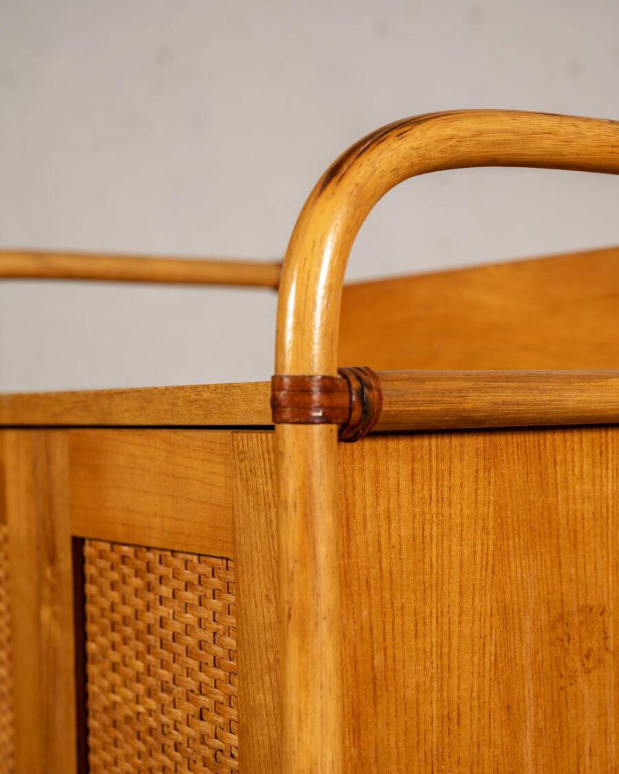 Small storage unit in cane and wood.