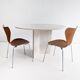 Round dining table in travertine from the 1980s.