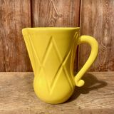 Vintage lemon yellow ceramic pitcher.